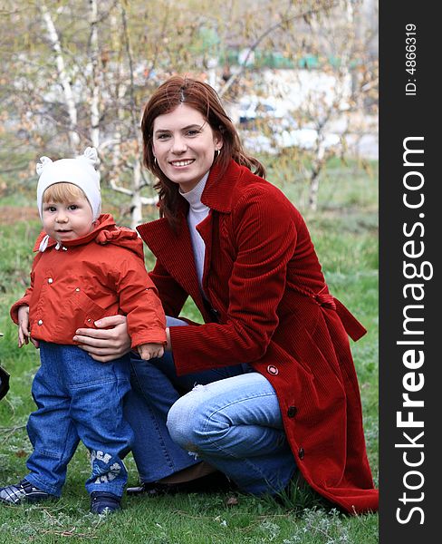 Young mum with the small beautiful son on walk. Young mum with the small beautiful son on walk