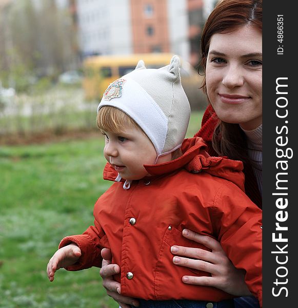 Young mum with the small beautiful son on walk. Young mum with the small beautiful son on walk