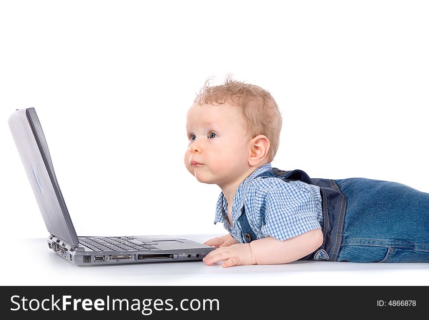 Baby with laptop on white