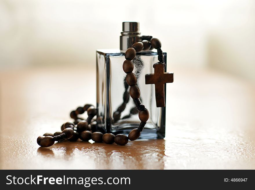 Cologne Bottle And Rosary