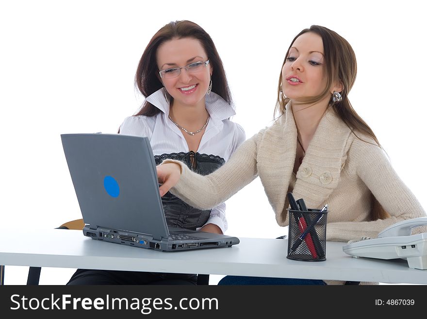 Two business woman work with laptop on white