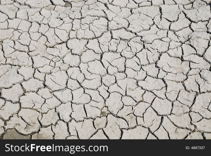 Cracks in dried mud at the bottom of the lake