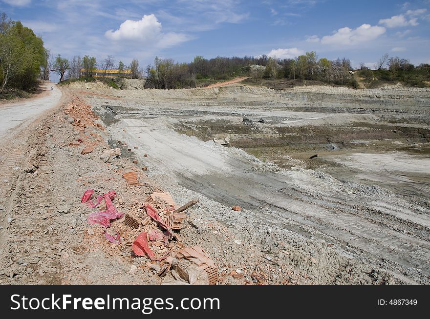 Huge opencast mine for digging the gault with the lake in the middle