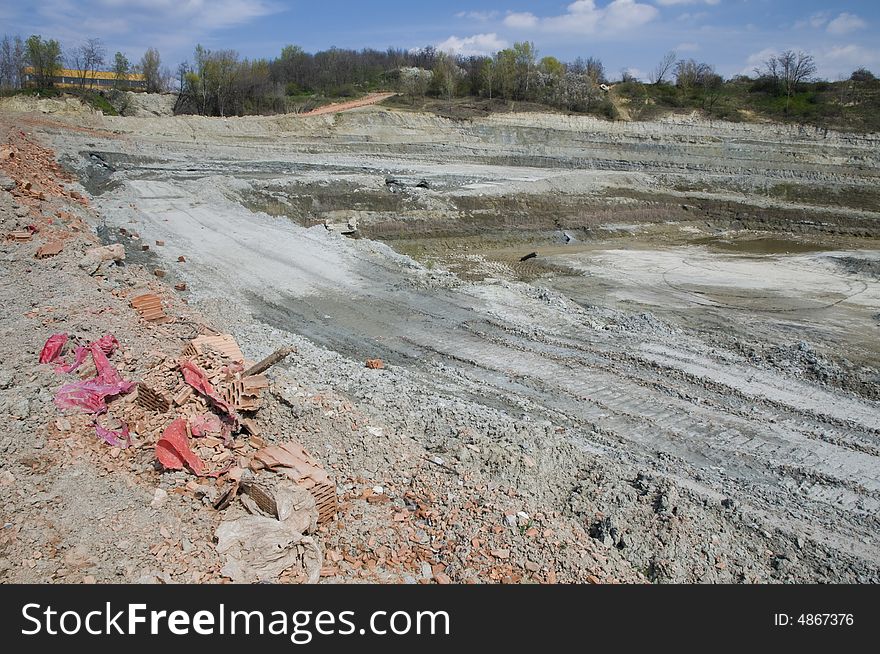 Huge opencast mine for digging the gault with the lake in the middle