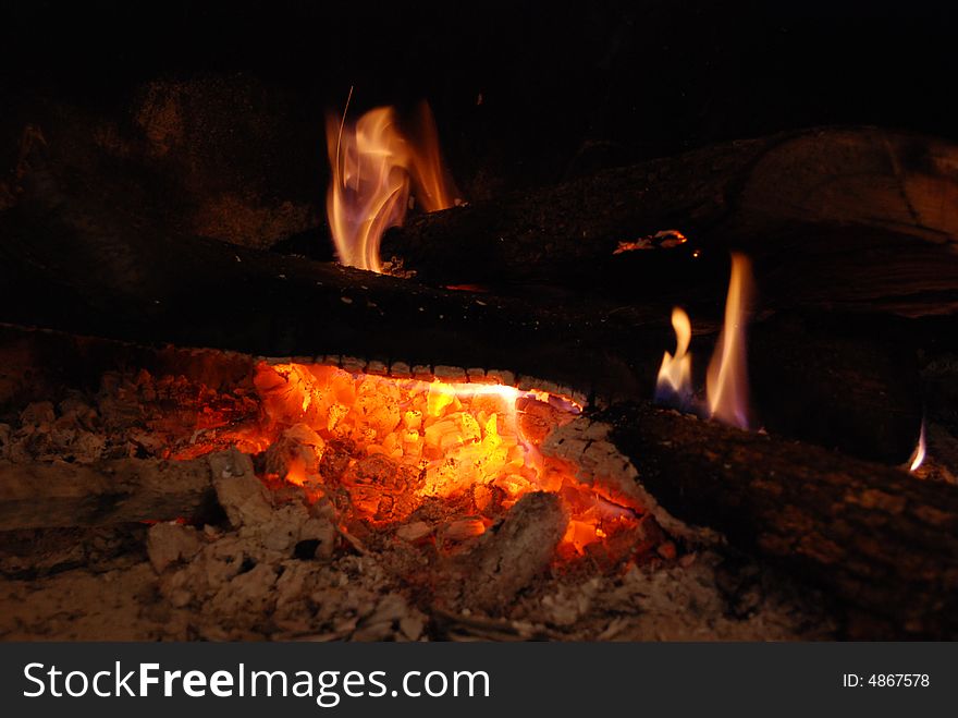 Logs burning in a fireplace - Liguria, Italy