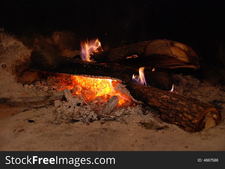 Logs burning in a fireplace - Liguria, Italy