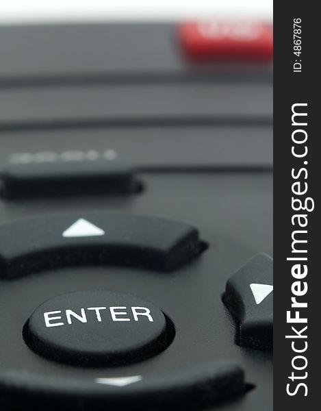 Detail photo of remote controller with only ENTER button in focus