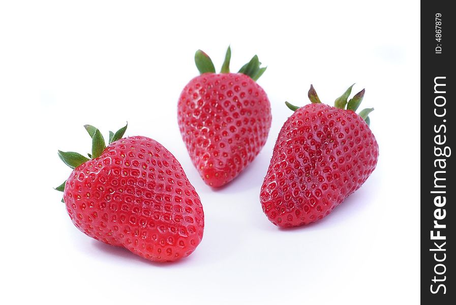 Three strawberrys on white background