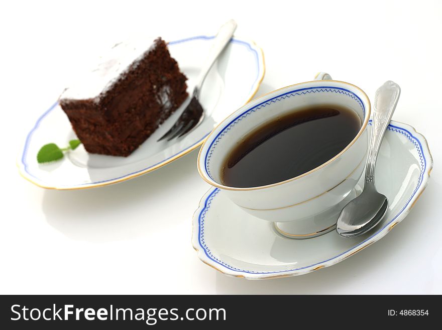 Cup of coffee and chocolate cake