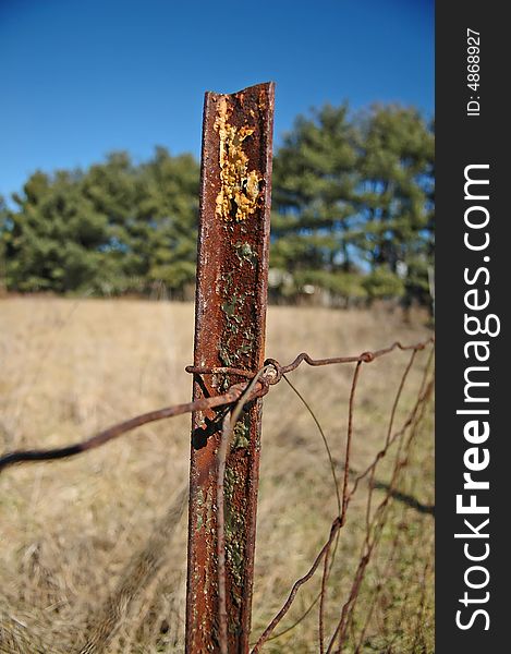 A decaying fence at an abandoned horse farm. A decaying fence at an abandoned horse farm