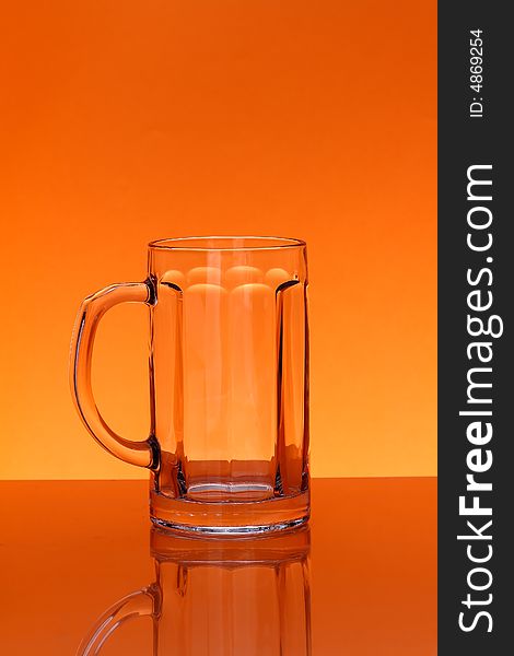 Empty mug over orange background. Empty mug over orange background