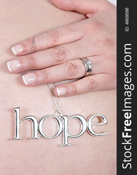 Silver Hope Sign on Belly of pregnant woman