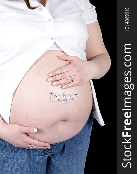 Hope Sign on Belly of pregnant woman with black background