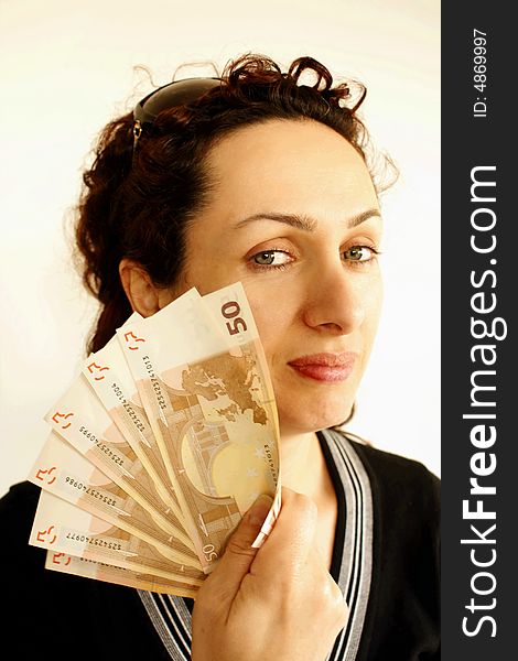Young woman holding a lot of euros (European Union currency). Young woman holding a lot of euros (European Union currency)