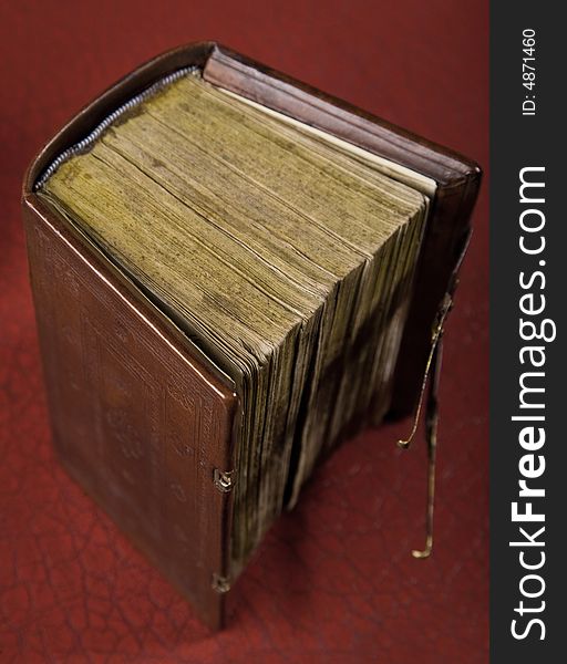 An old book on a red background soft focus. An old book on a red background soft focus