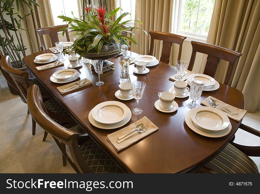 Dining table with modern tableware. Dining table with modern tableware.