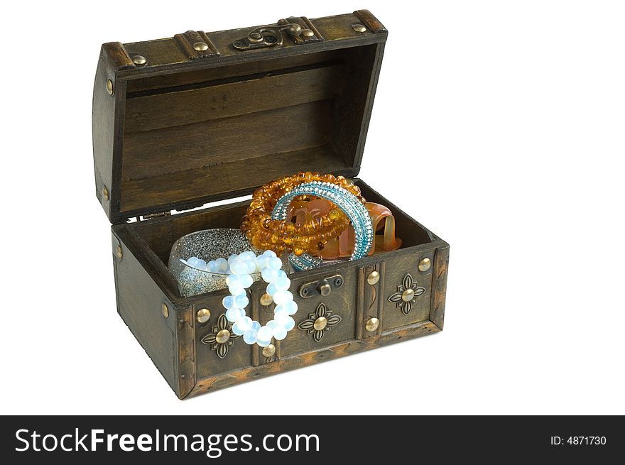 Isolated oriental wooden box with jewelry on a white background. Isolated oriental wooden box with jewelry on a white background