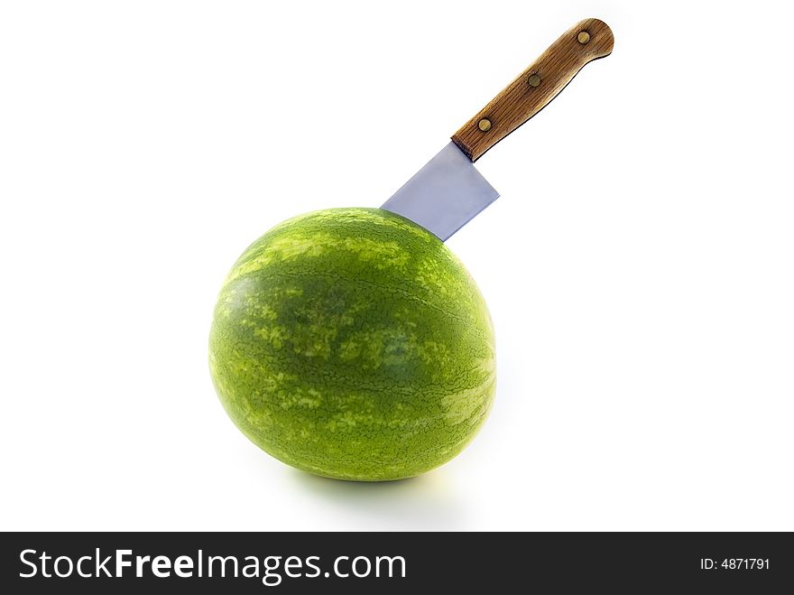 Watermelon with a knife isolated on white