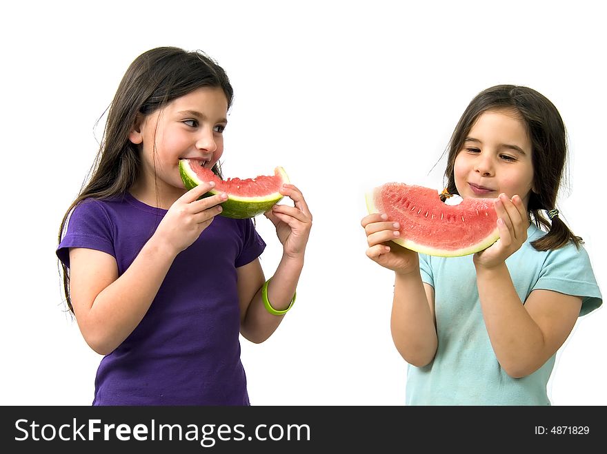 Two girls eating Watermelon