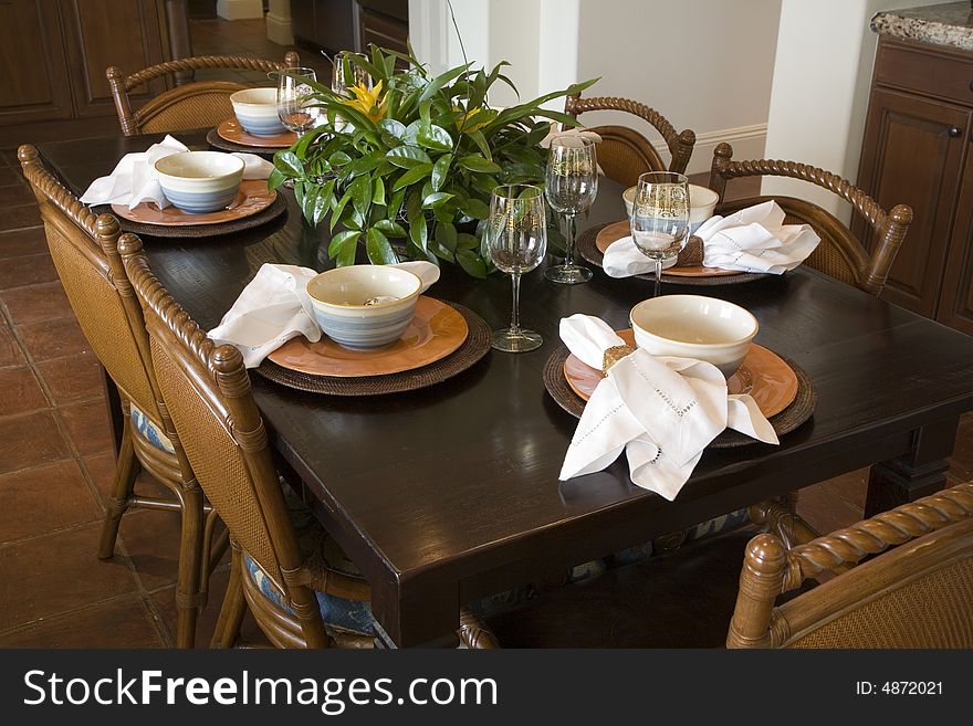 Dining table with modern tableware. Dining table with modern tableware.