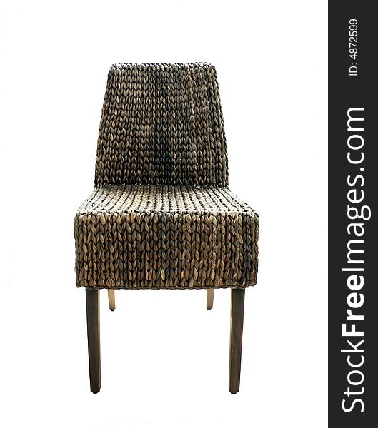 A modern styled wicker chair isolated on white background via a clipping path. A modern styled wicker chair isolated on white background via a clipping path