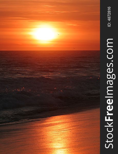 The sun reflecting off the sand on the beach in Newport Beach, California, USA. The sun reflecting off the sand on the beach in Newport Beach, California, USA