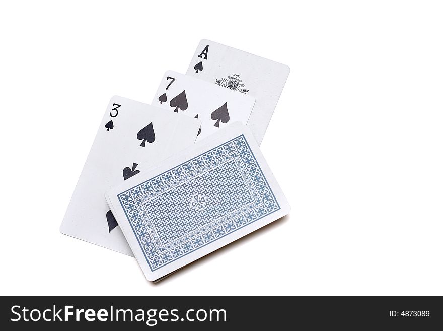 Playing cards laying on a white background