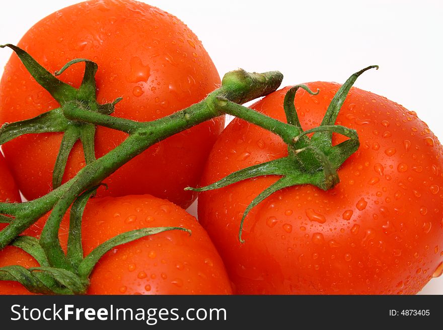 Close up on three fresh and juicy tomatoes