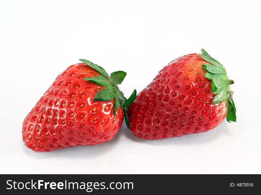 Two strawberry on the neutral background