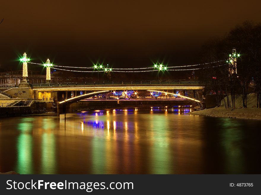 Bridge and reflections at night in Winter. Bridge and reflections at night in Winter