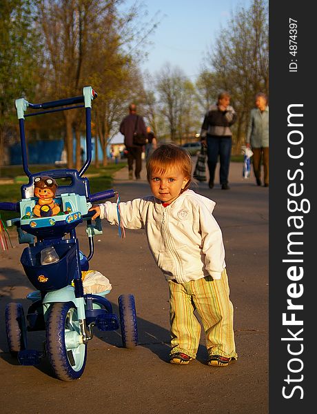 Girl And Her Tricycle