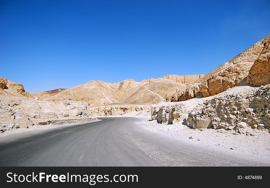 Road through the desert and sandy hills. Road through the desert and sandy hills