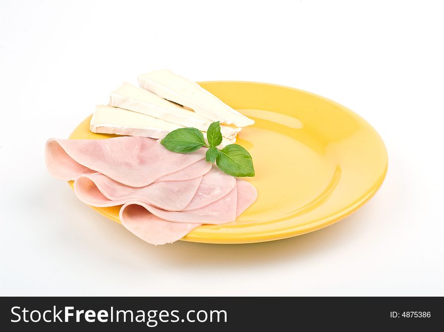 Ham and cheese on yellow  plate. Ham and cheese on yellow  plate