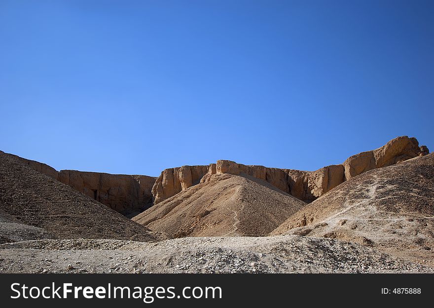 Orange rocks and white sand on the desert and the blue sky in egypt