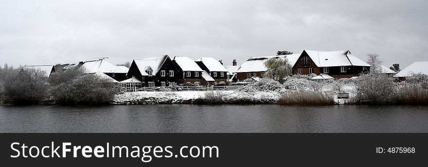 Snow covered rooftops next to the River Thames in Berkshire