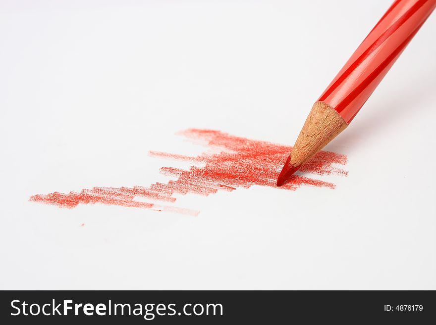 A red color pencil sketching and coloring on a white paper