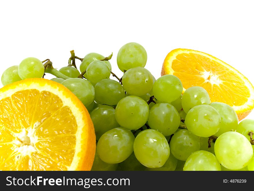 Grapes and two halfs of orange close-up