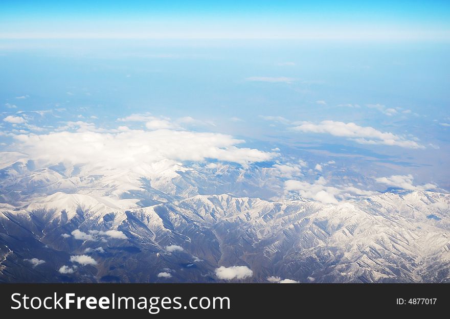 Beautiful snow mountain under clouds