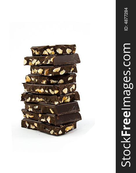 Tower of black chocolate isolated on white. Tower of black chocolate isolated on white