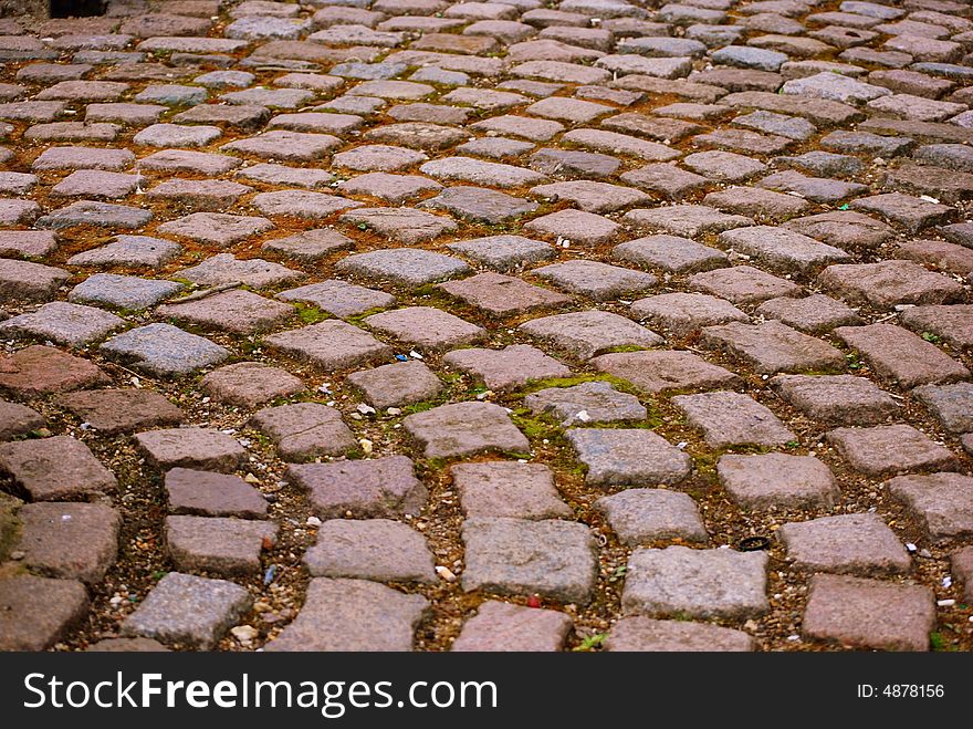 A circular brick cobbled pathway