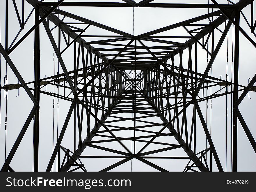 A view looking up into the height of a powerful pylon. A view looking up into the height of a powerful pylon