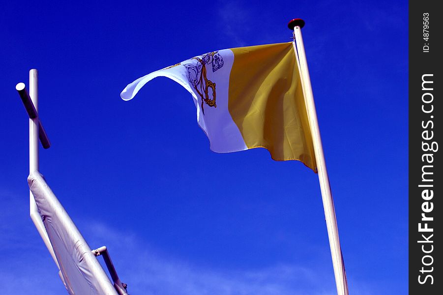 The pope's flag and church.