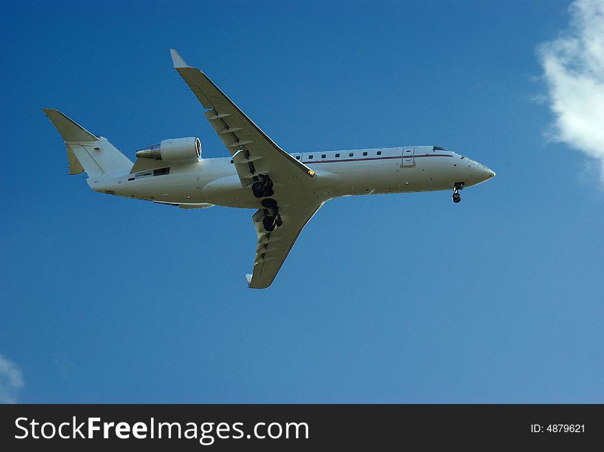 Aeroplane seen from ground on blue sky. Aeroplane seen from ground on blue sky