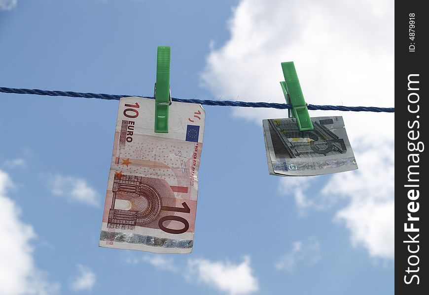 Euro banknotes hanging on laundry line. Euro banknotes hanging on laundry line