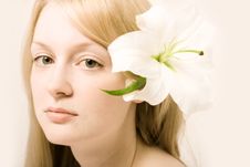 Young Woman With White Lily Royalty Free Stock Photography