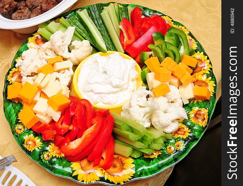A full plate of veggies and cheese. A full plate of veggies and cheese