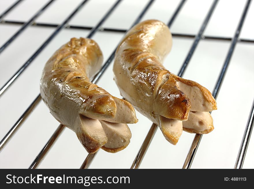 Grilled Sausages on a white background