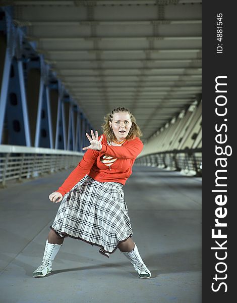 Young beautiful woman listen music and dancing at bridge. Young beautiful woman listen music and dancing at bridge.