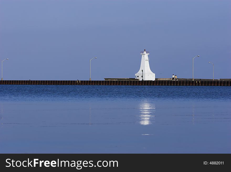 Lighthouse On End Of A Pier