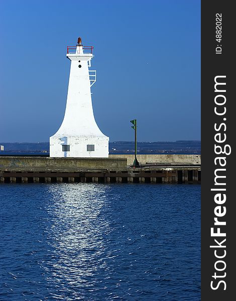 White lighthouse on a pier